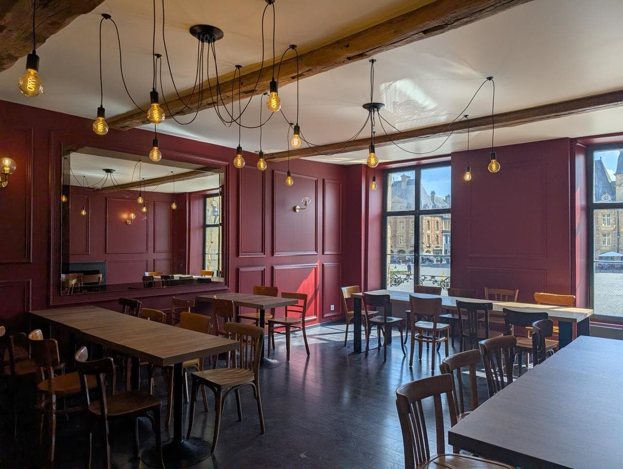 Indoor dining with a view of the Place Ducale